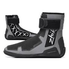 Close-up of non-slip sailing shoes on a wet boat deck.